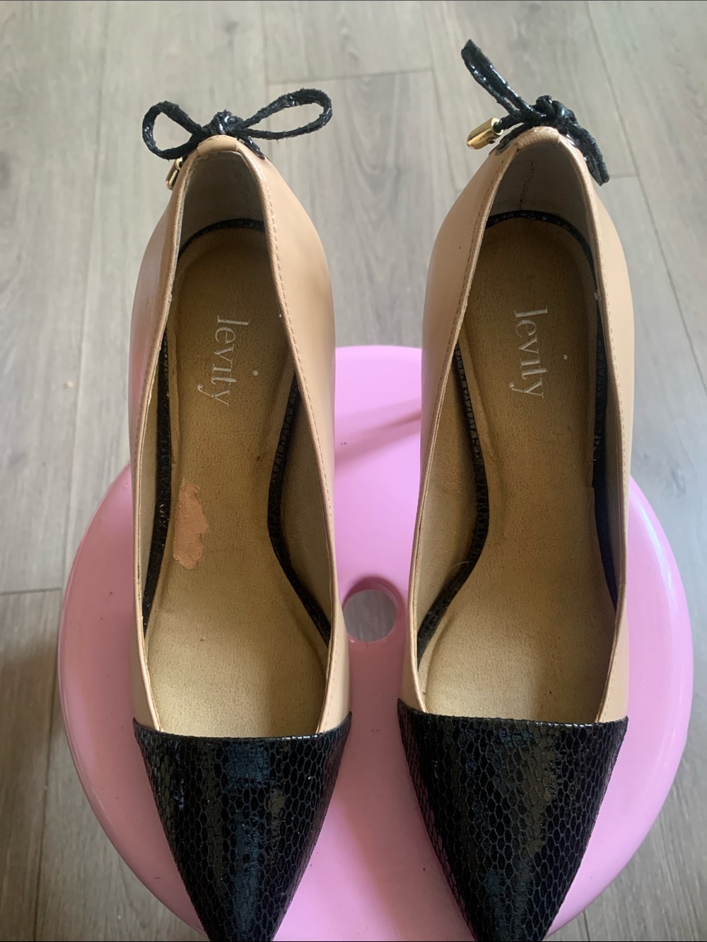 levity Beige Flats with Black Pointed Toe and Bow Accent